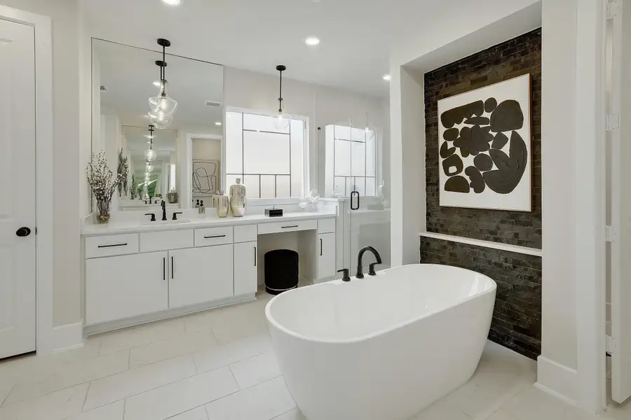 Furnished interior in a model home at New Haven - 60' in Manor (Image 16).