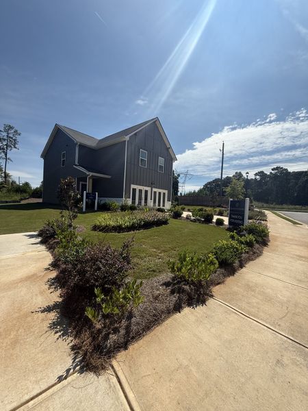 A charming dark-colored home with crisp landscaping in Campground Crossing by Dream Finders Homes (Mcdonough, GA). A charming dark-colored home with crisp landscaping in Campground Crossing by Dream Finders Homes (Mcdonough, GA).