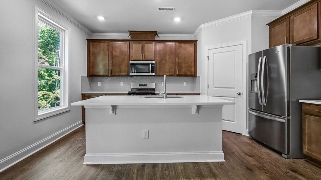 Furnished interior in a model home at The Estates Park in Apex (Image 7).