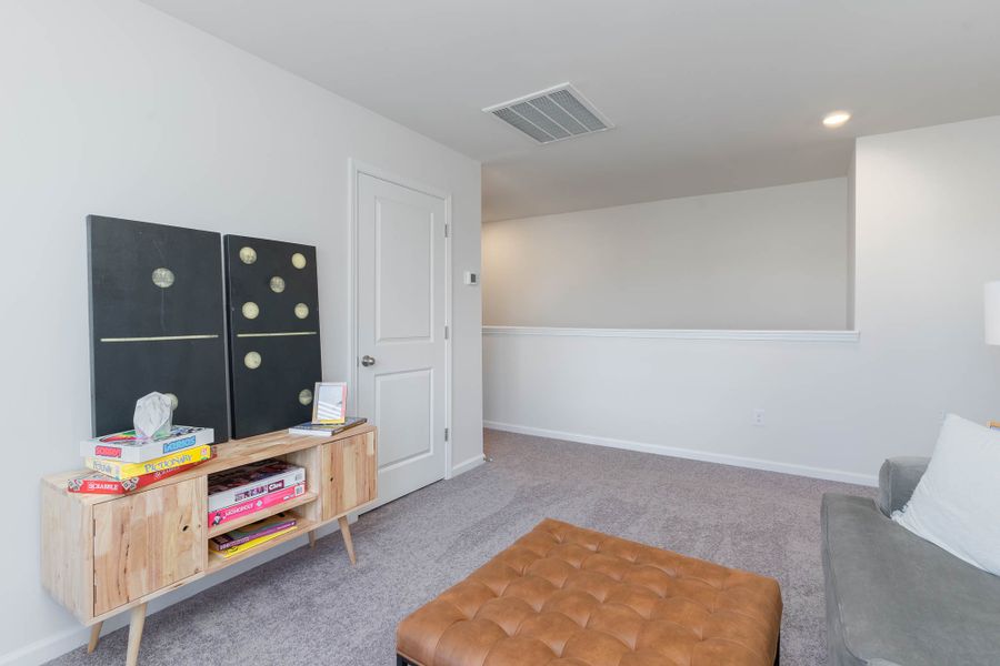 Furnished interior in a model home at Island Green in Myrtle Beach (Image 39).