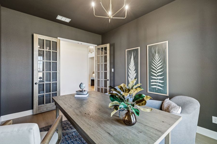 Furnished interior in a model home at Settler's Glen in New Fairview (Image 18).