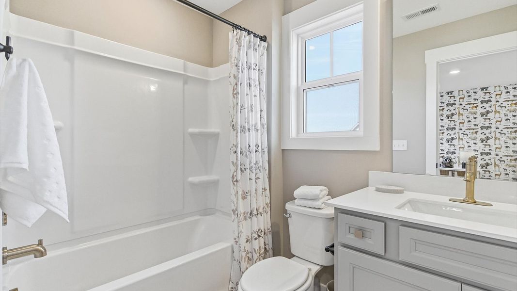 Furnished interior in a model home at Benjamin's Grove in Woodruff (Image 31).