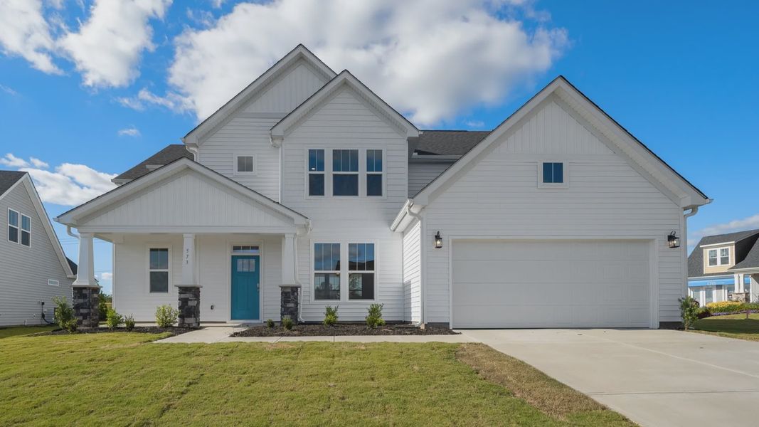 New two story home with light gray exterior and green front door at Pinebrook by DRB Homes in Woodruff, SC New two story home with light gray exterior and green front door at Pinebrook by DRB Homes in Woodruff, SC