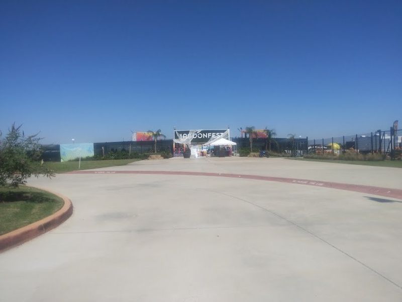 A sunny entrance view with event setup in Lago Mar by M/I Homes, La Marque, TX, showcasing a vibrant community area. A sunny entrance view with event setup in Lago Mar by M/I Homes, La Marque, TX, showcasing a vibrant community area.