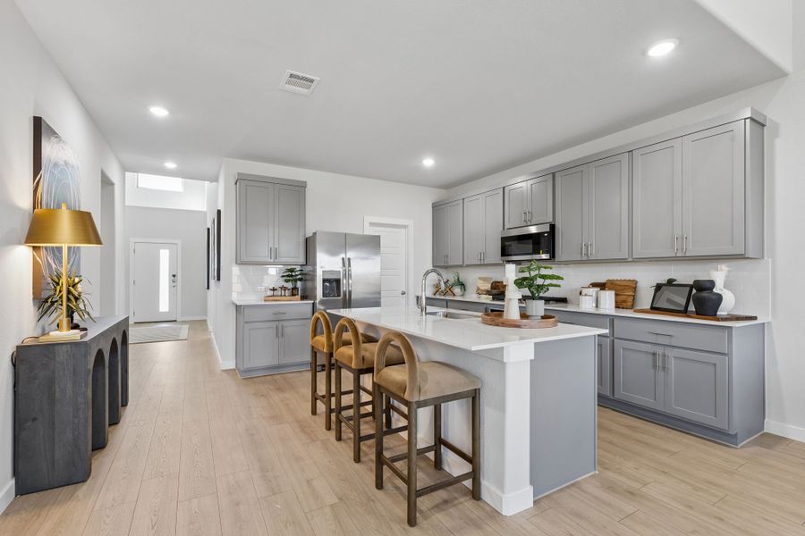 Kitchen in the Winters model home in Gunter TX by Trophy Signature Homes