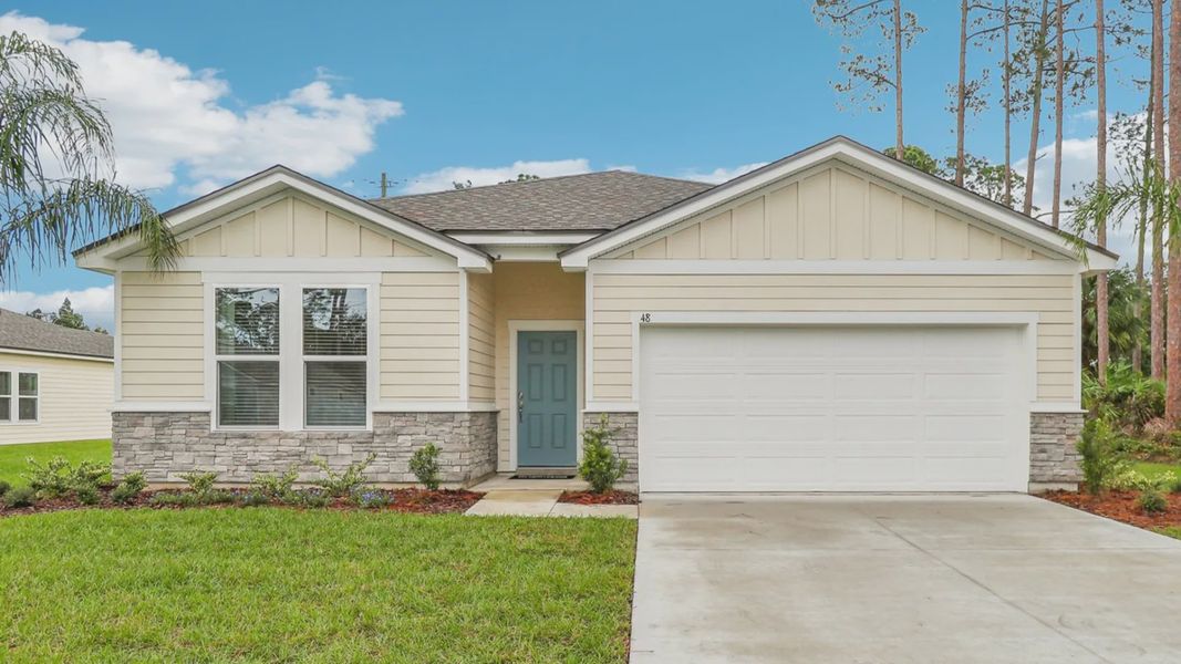 Elegant Palm Coast residence with stone accents and lush landscape embodies timeless sophistication.