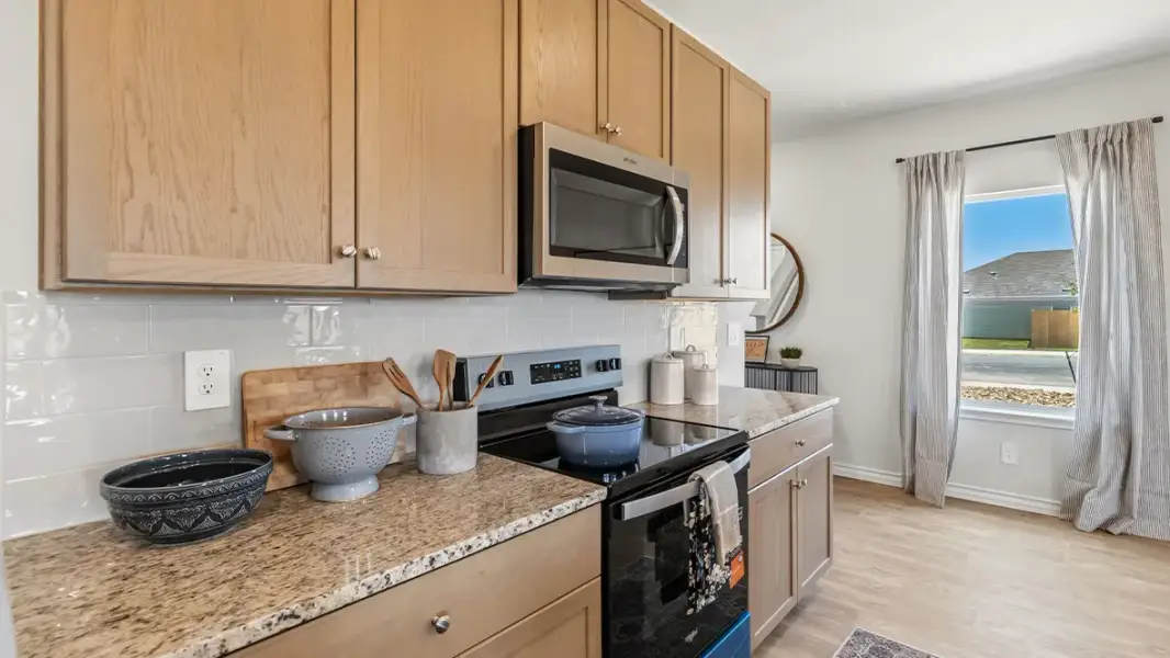 Furnished interior in a model home at Saddle Ridge Estates in Lytle (Image 16).