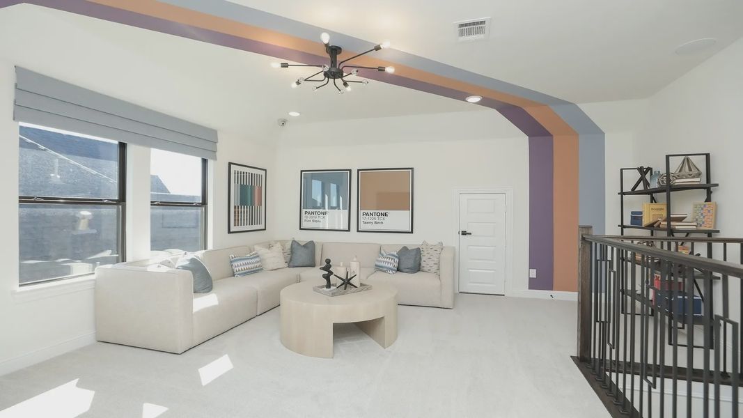 Experience luxury in Brookewater with a plush, neutral sofa, bold accent beams, and elegant railing. Experience luxury in Brookewater with a plush, neutral sofa, bold accent beams, and elegant railing.