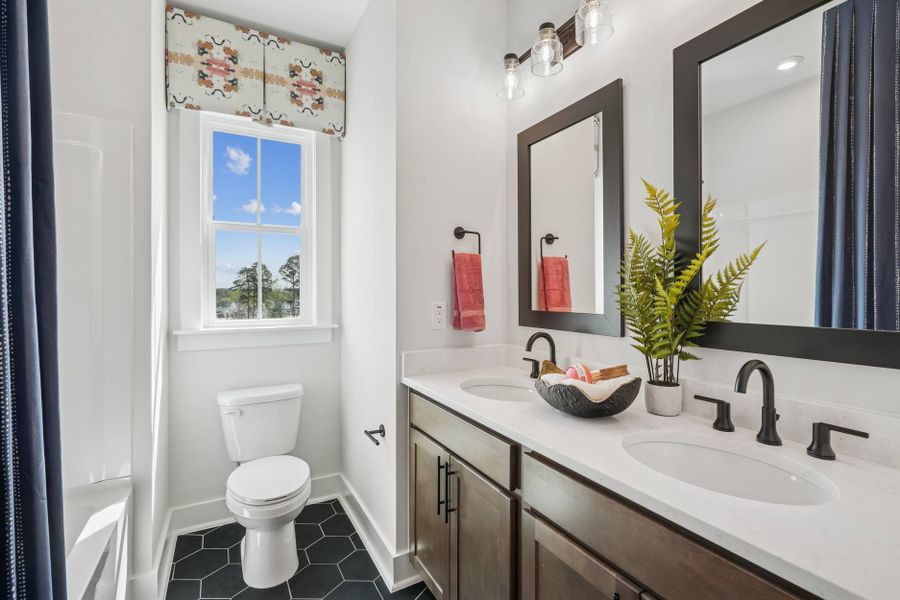 Furnished interior in a model home at Mews at Holding Village in Wake Forest (Image 41).