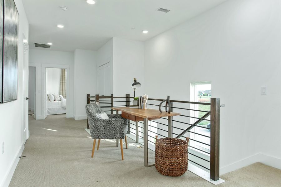 Furnished interior in a model home at Windsong Ranch Townhomes in Prosper (Image 7).