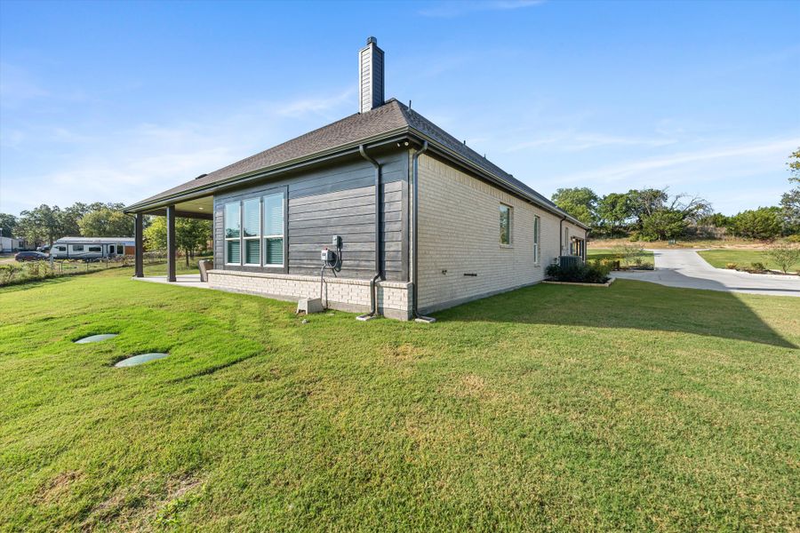 Front exterior of a home in the Oak Grove Addition community, located in Springtown, TX (Image 14).