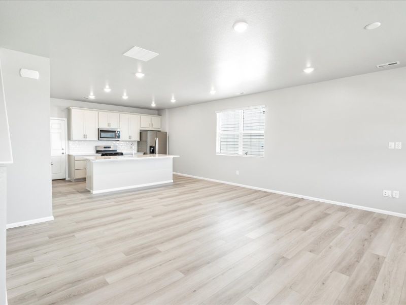 Dining area in the Woodland floorplan at a Meritage Homes community in Broomfield, CO.