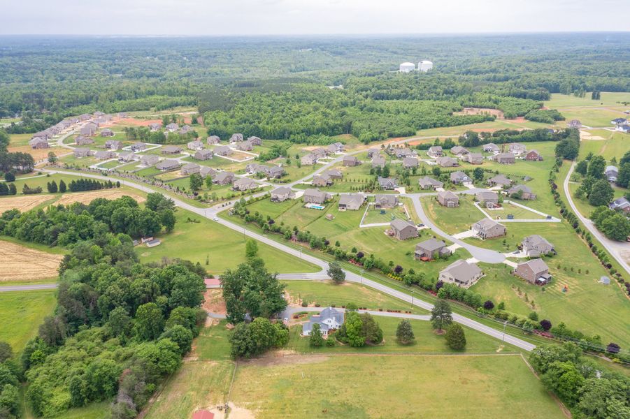 Aerial view of the Northwest Meadows community in Stokesdale, NC, showing layout and nearby surroundings (Image 1). Aerial view of the Northwest Meadows community in Stokesdale, NC, showing layout and nearby surroundings (Image 1).