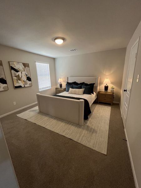 A cozy bedroom features a plush bed, soft lighting, neutral tones, and elegant wall art for a serene atmosphere. A cozy bedroom features a plush bed, soft lighting, neutral tones, and elegant wall art for a serene atmosphere.
