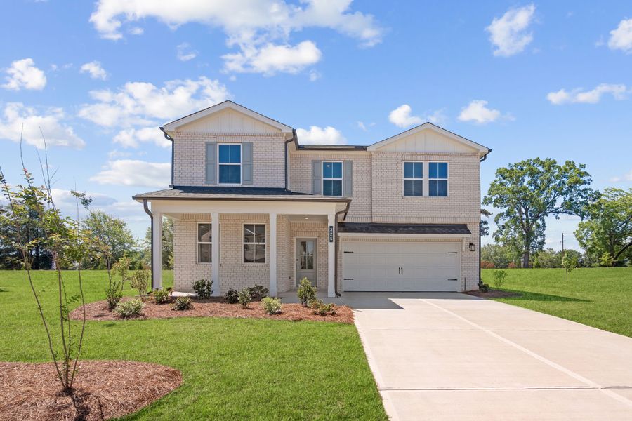 A house with a driveway. A house with a driveway.