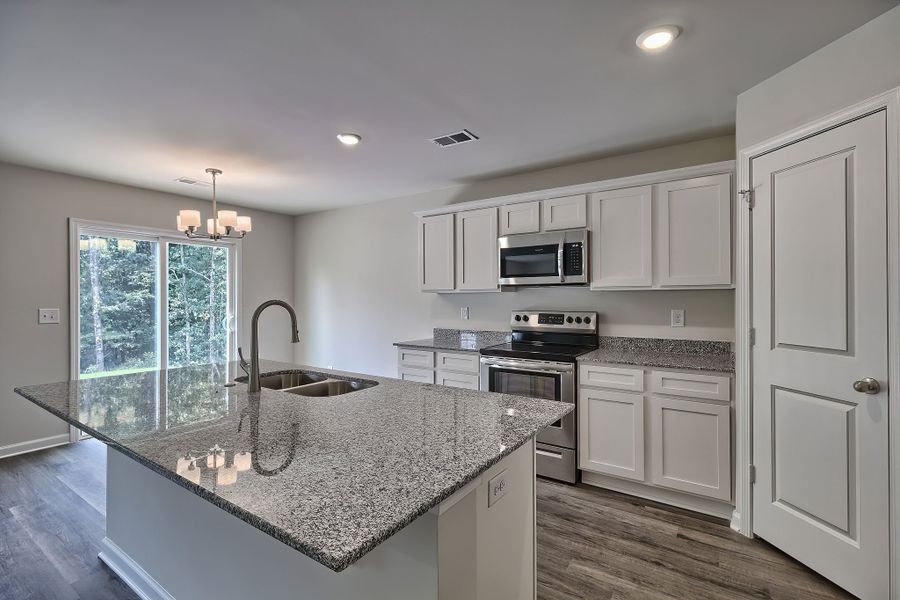 Furnished interior in a model home at South Welcome in Greenville (Image 5).