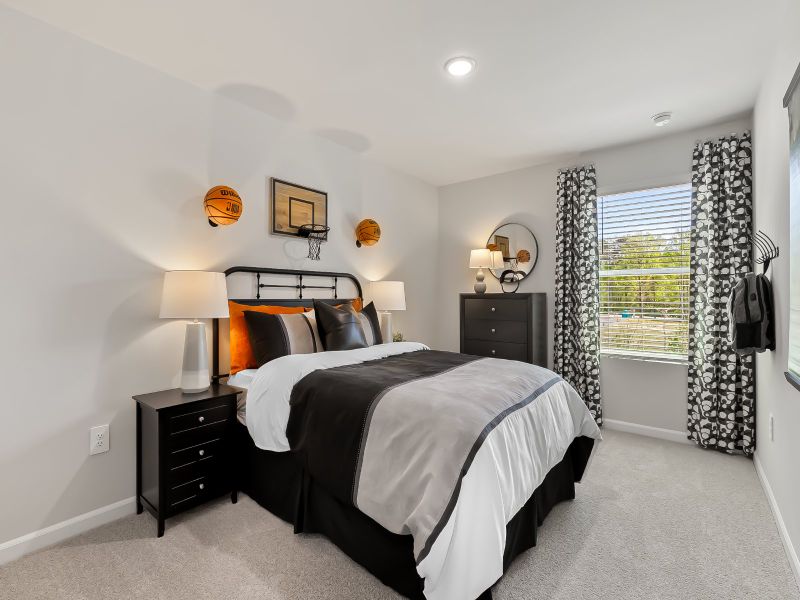 Two secondary bedrooms are ideally situated away from the primary suite.