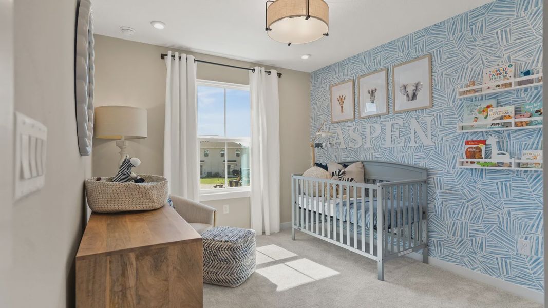 The third bedroom at Cyrene at Harmony by DRB Homes features ample natural lighting, creating a warm and inviting atmosphere. The third bedroom at Cyrene at Harmony by DRB Homes features ample natural lighting, creating a warm and inviting atmosphere.