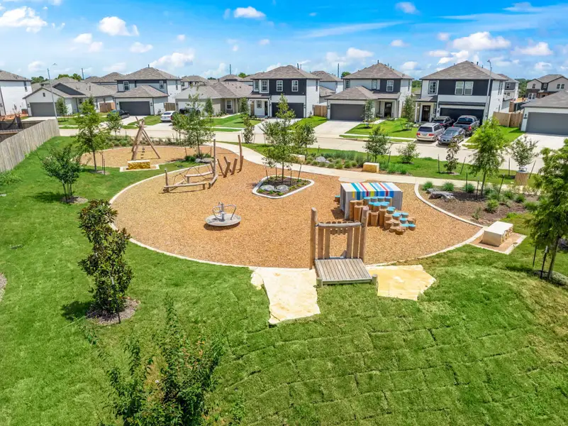 A backyard with a pool and houses.