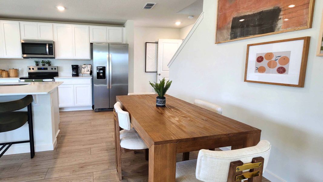 Furnished interior in a model home at Vineland Reserve in Osteen (Image 8).