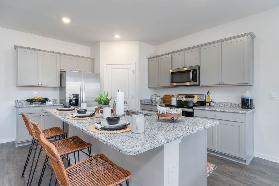 Furnished interior in a model home at Island Green in Myrtle Beach (Image 28).
