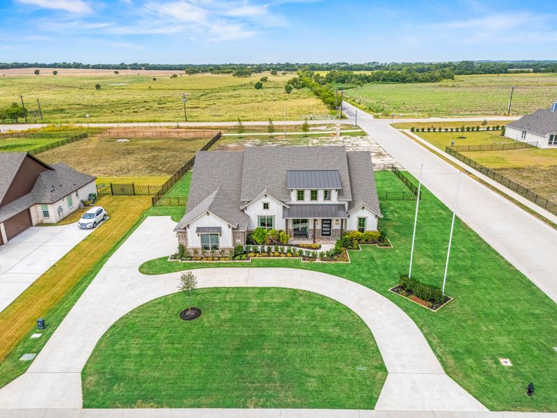 Front exterior of a home in the Paloma Ranch community, located in New Fairview, TX (Image 4).
