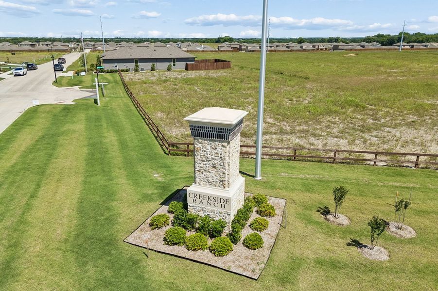 Front exterior of a home in the Creekside Ranch community, located in Blue Ridge, TX (Image 34).