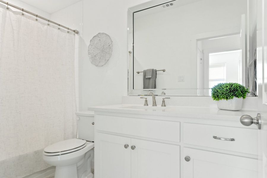 Furnished interior in a model home at Windsong Ranch Townhomes in Prosper (Image 24).