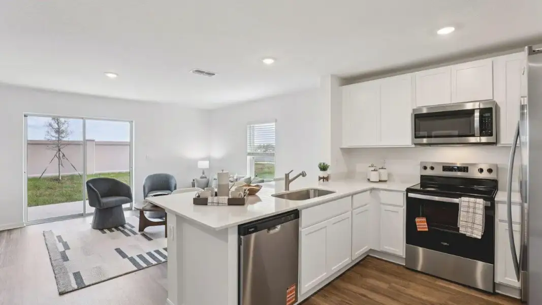Furnished interior in a model home at Crosswinds Townhomes in Haines City (Image 5).