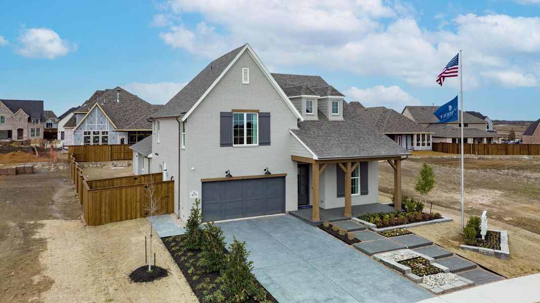 Front exterior of a home in the Windsong Ranch - The Enclave community, located in Prosper, TX (Image 11). Front exterior of a home in the Windsong Ranch - The Enclave community, located in Prosper, TX (Image 11).