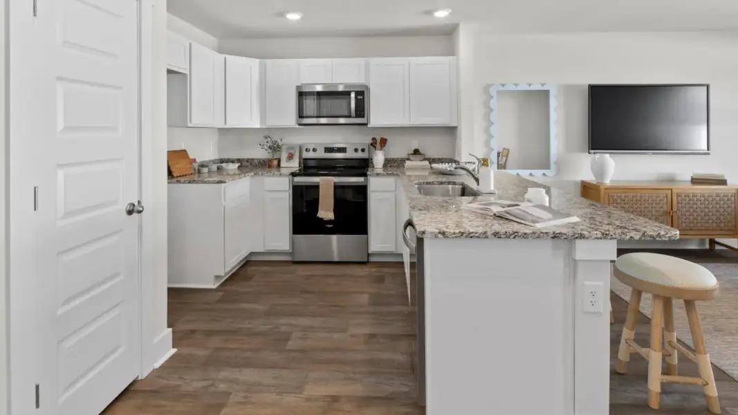 Furnished interior in a model home at The Townes at Cedar Hill Landing in Navassa (Image 8).