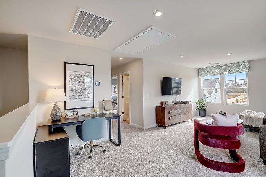 A room with a desk and chairs. A room with a desk and chairs.