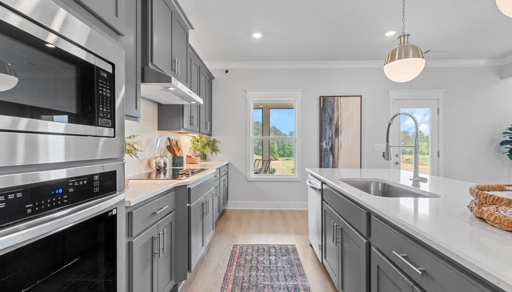 Furnished interior in a model home at Summerlin in Winder (Image 30).