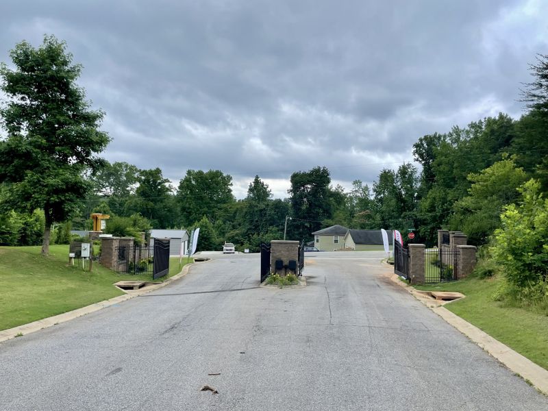 Entrance to the Pointe Summit community in Slater-Marietta, SC, featuring signage and landscaping (Image 11). Entrance to the Pointe Summit community in Slater-Marietta, SC, featuring signage and landscaping (Image 11).