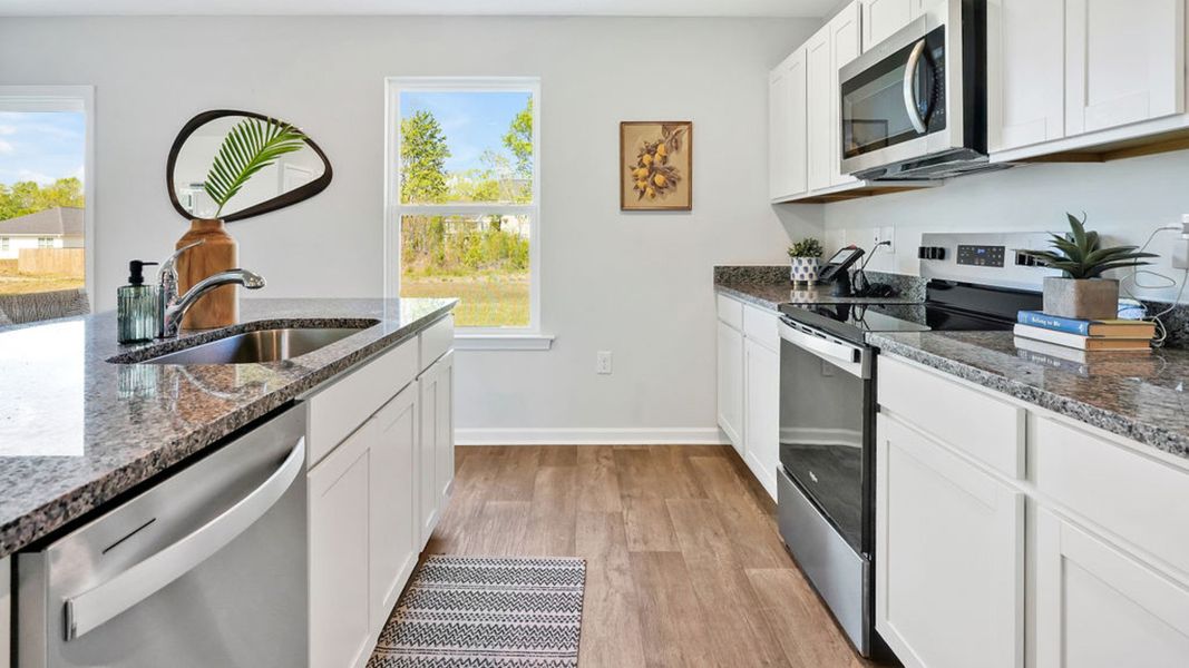 Furnished interior in a model home at Patriot Pointe at Towne Pointe in Jacksonville (Image 9).