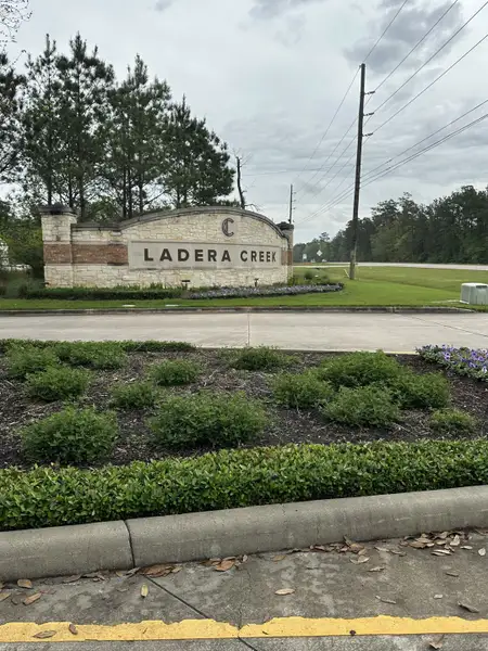 Charming entrance sign with lush landscaping in Ladera Creek by Lennar in Conroe, TX, welcoming you home. Charming entrance sign with lush landscaping in Ladera Creek by Lennar in Conroe, TX, welcoming you home.