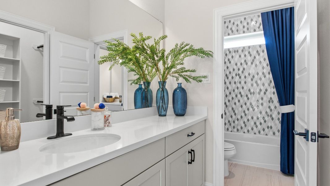 Guest bathroom with ample cabinet space