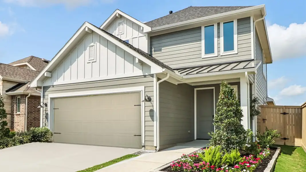 Front exterior of a home in the The Cottages Collection at Oakberry Trails community, located in Waller, TX (Image 2).