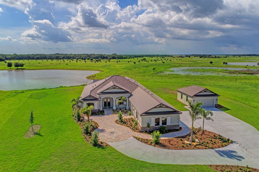 Front exterior of a home in the Hampton Lakes community, located in Sarasota, FL (Image 4).