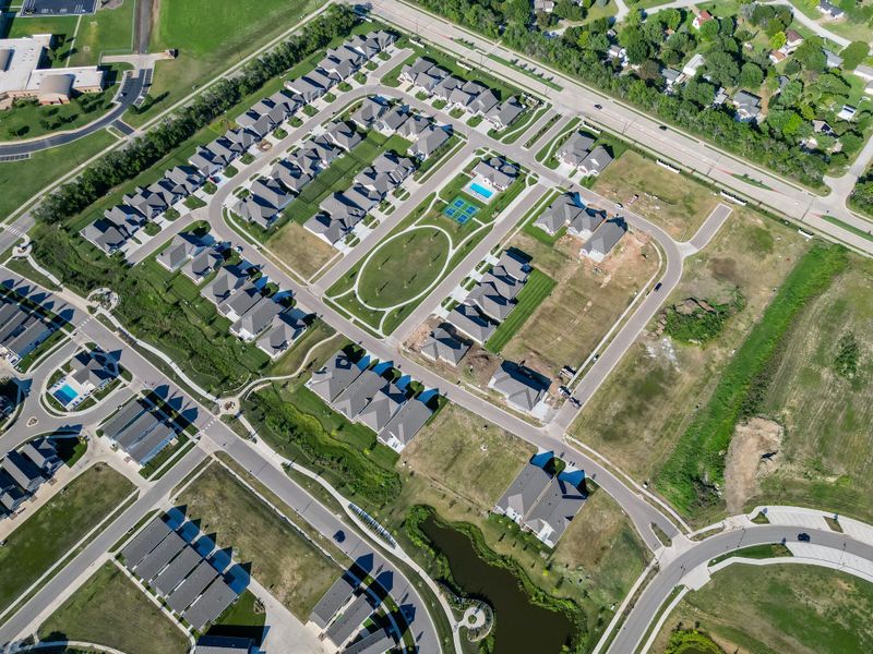 Aerial view of the The Courtyards at The Heritage community in Andover, KS, showing layout and nearby surroundings (Image 11). Aerial view of the The Courtyards at The Heritage community in Andover, KS, showing layout and nearby surroundings (Image 11).