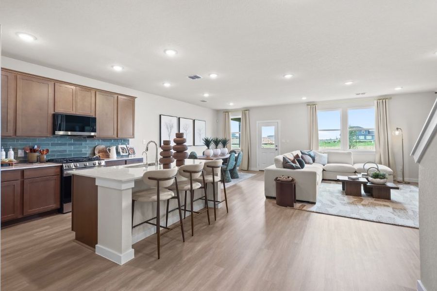 A large kitchen with a large island. A large kitchen with a large island.