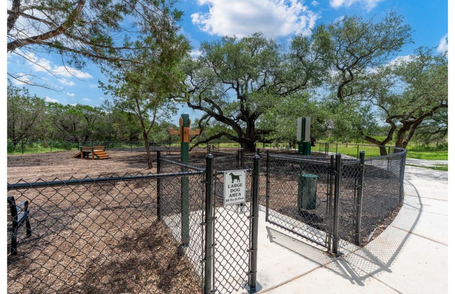 Spacious community dog park where residents and pets can play and socialize. Spacious community dog park where residents and pets can play and socialize.