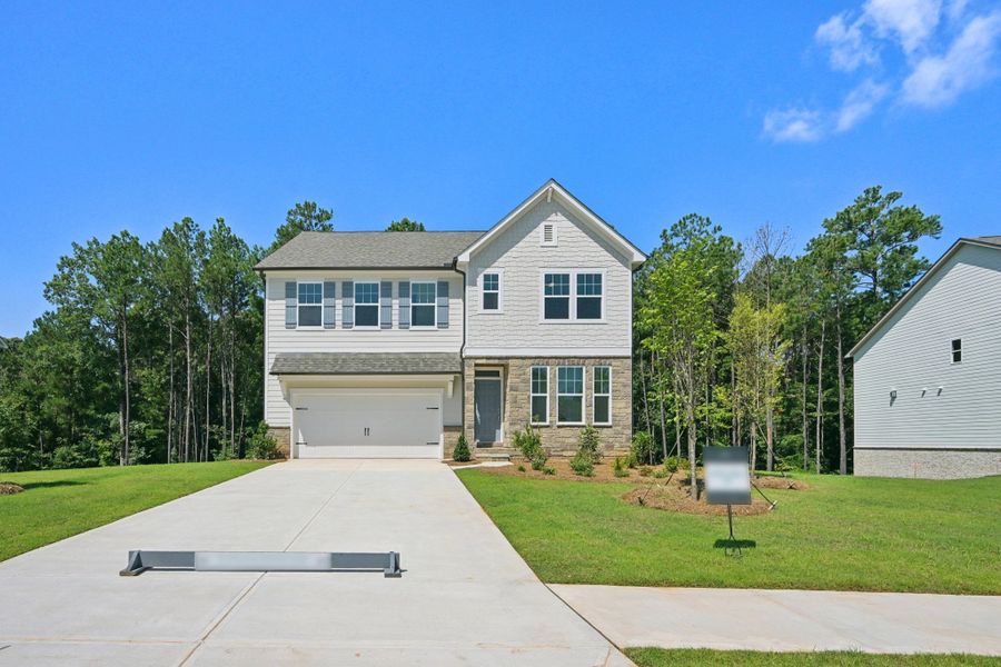Front exterior of a home in the The Pointe at Heron Bay community, located in Locust Grove, GA (Image 4). Front exterior of a home in the The Pointe at Heron Bay community, located in Locust Grove, GA (Image 4).