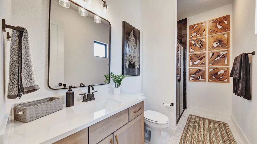 Luxurious bathroom with custom wood accents and modern fixtures in Hawkes Landing.