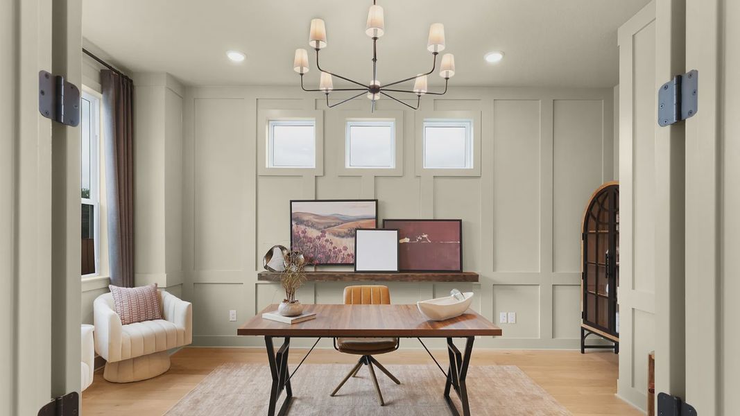 Dedicated office with abundant natural light, creating a calm, modern workspace design.