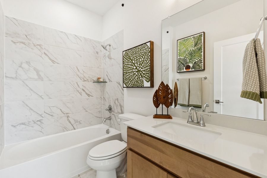 REPRESENTATIVE PHOTO – Bathroom in the Winters model home in Aledo TX by Trophy Signature Homes
