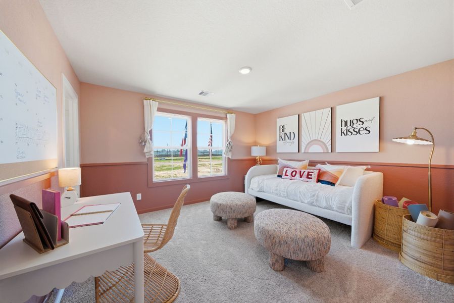 A living room with a couch and a table. A living room with a couch and a table.