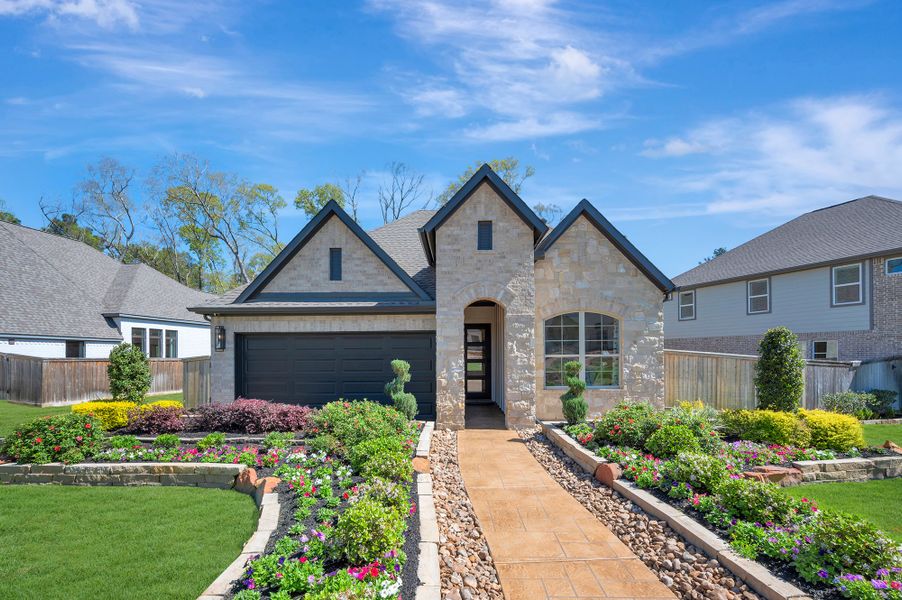 Front exterior of a home in the The Woodlands Hills - Reserve Collection community, located in Willis, TX (Image 3).