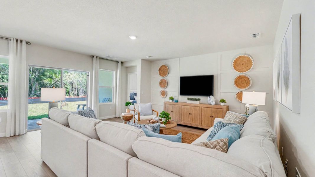 Furnished interior in a model home at Indian River Preserve in Mims (Image 12).