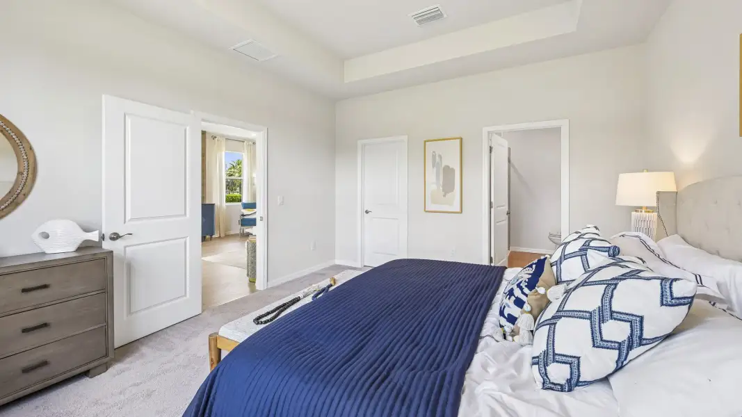 Furnished interior in a model home at Gladstone Park Villas in Sarasota (Image 19).